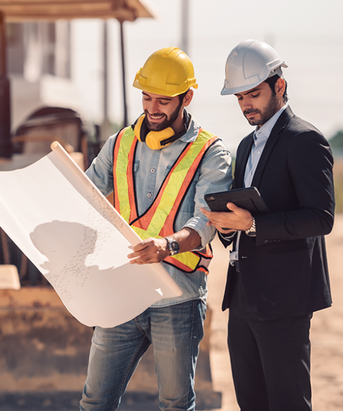 civil-engineer-construction-worker-manager-holding-digital-tablet-blueprints-talking-planing-about-construction-site-cooperation-teamwork-concept